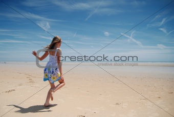 Young girl having fun on the beach