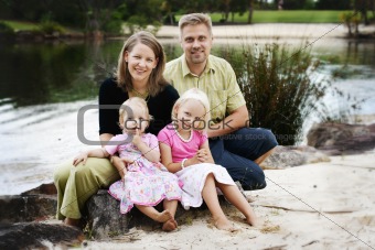 Family enjoying themselves in an outdoor nature setting.