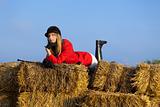 girl jockey / on a background of blue sky and hay