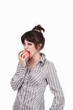 The girl biting a red juicy apple