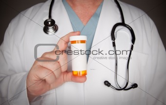 Male Doctor with Stethoscope and Blank Medicine Bottle.