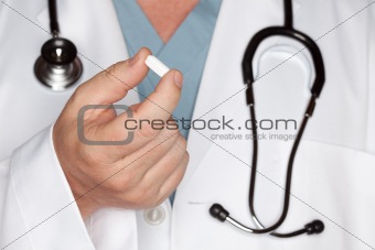 Male Doctor Abstract with Stethoscope and Pill -  Narrow Depth of Field.