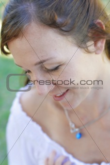 Close-up portrait of a happy attractive woman outdoors.