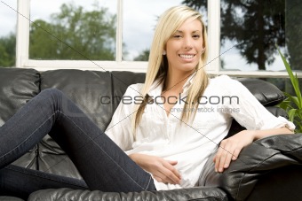 Female model relaxing on sofa
