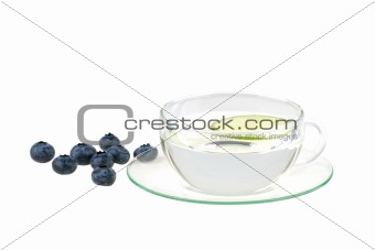 cup of water with lemon and huckleberries