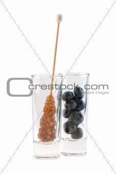 rock sugar and huckleberries in glass