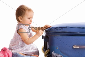 Baby zipping suitcase