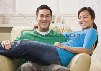 Attractive Smiling Couple on Sofa