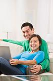 Couple Hugging with Laptop