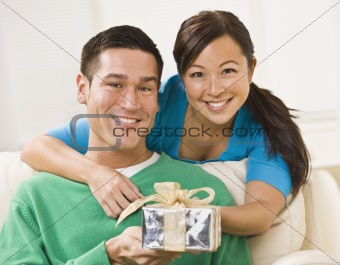 Couple Holding Present
