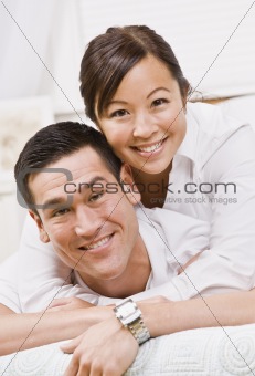 Attractive Couple Hugging and Smiling at the Camera