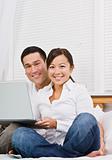 Asian couple with laptop