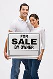 Couple With For Sale By Owner Sign