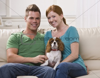 Couple Holding Dog