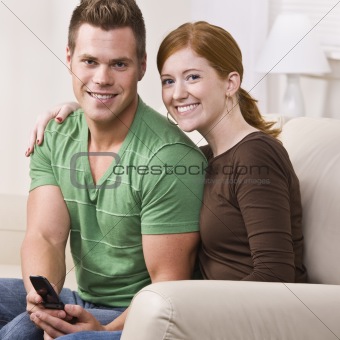 Attractive Couple Smiling with Cellphone