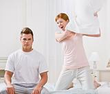 Attractive Couple Playing Around with a Pillow Fight