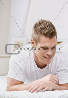 Man Relaxing on Bed