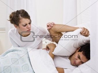 Wife Trying to Wake Up her Husband