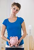 Female Holding Piggy Bank
