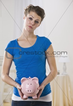 Female Holding Piggy Bank