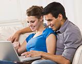 Attractive Couple Working on Laptop Together