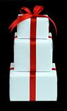 three white gift boxes with red ribbon