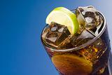 refreshing glass of cola with lemon and ice