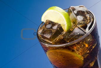 refreshing glass of cola with lemon and ice