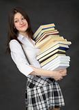 Schoolgirl with the big pile of books