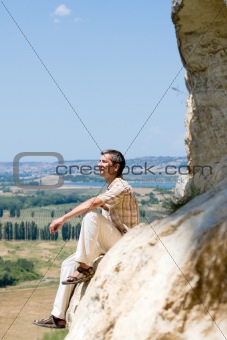 man resting on the mountain rock