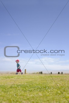 cute toddler running by sea