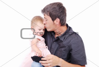 Father kissing his daughter