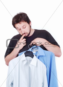 Confused male model between two shirts