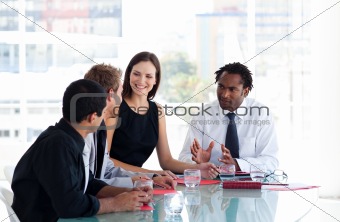 Business team interacting to each other in office