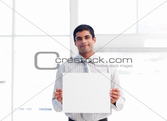 Hispanic businessman presenting a white card