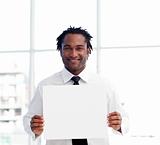 Portrait of an Afro-American businessman holding a white card