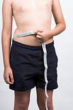  boy measuring waist