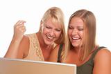Two Laughing Woman Using Laptop Isolated on a White Background.