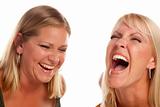 Two Beautiful Sister Laughing Isolated on a White Background.