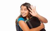 Pretty Hispanic Girl Waving with Books and Backpack Ready for School Isolated on a White Background.