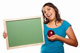 Pretty Hispanic Girl Holding Blank Chalkboard and Apple Isolated on a White Background.