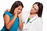 Unhappy Hispanic Girl and Concerned Female Doctor Isolated on a White Background.