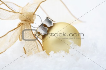 Gold Christmas bauble decoration with ribbon.