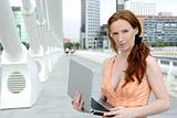 Beautiful redhead woman with laptop
