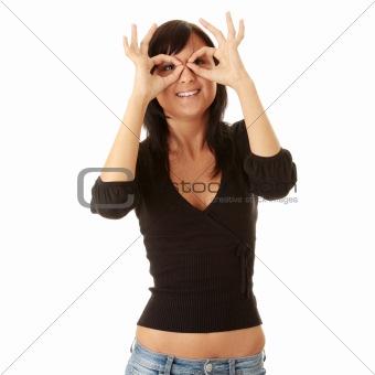 Woman looking through fingers