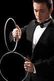 young magician with silver metal rings
