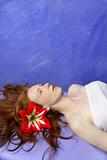 Beautiful redhead woman in massage blue board