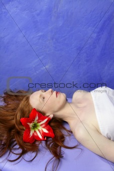 Beautiful redhead woman in massage blue board