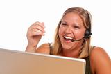 Attractive businesswoman Laughs as she talks on her phone headset.