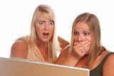 Two Shocked Women Using Laptop Isolated on a White Background.